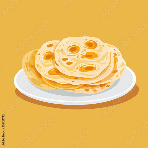 A plate of yellow tortillas with a white plate underneath. The plate of tortillas is piled high and looks delicious