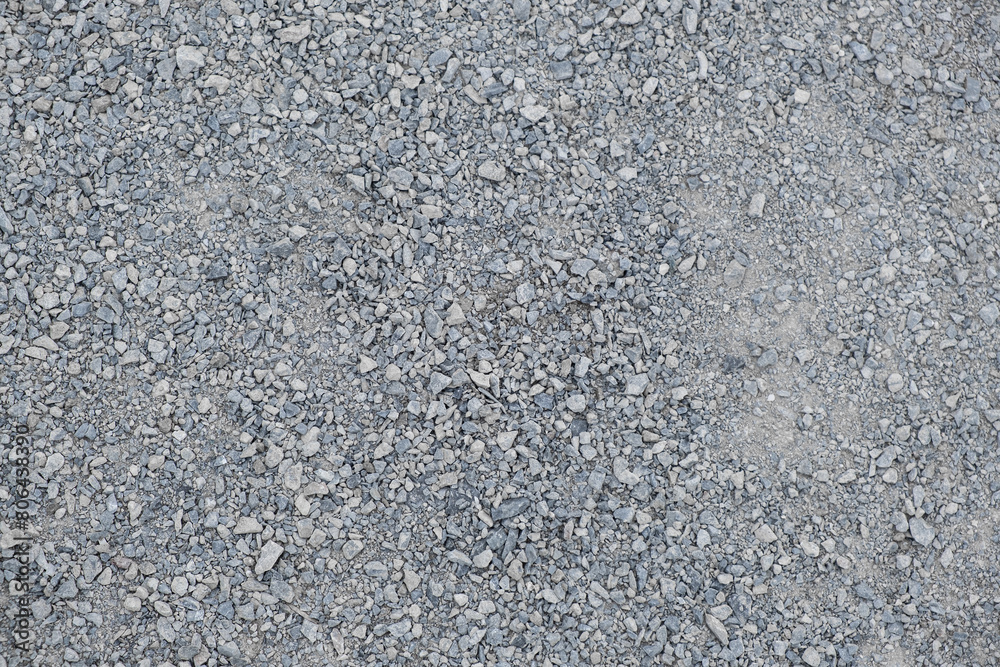 A frame filled with Gravel way the textured surface of finely crushed stone on the walking path