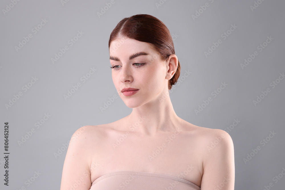 Portrait of beautiful woman on grey background Portrait of beautiful woman on grey background