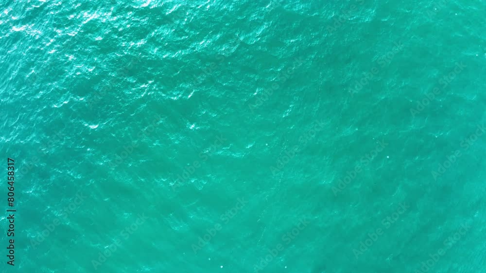 Beautiful sea summer landscape, Waves sea water surface High quality video Bird's eye view, Drone top view waves crashing on sand beach,Nature ocean sea beach background