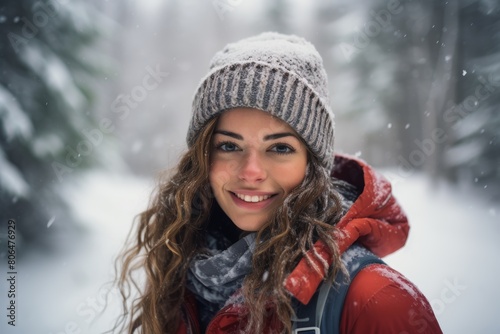 A Serene Portrait of a Woman Embracing the Winter Wonderland as She Stands Proudly at the Beginning of a Snowshoe Trail