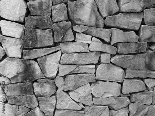 Black and white of stone wall texture. Stone wallpaper.