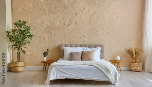 Minimalist interior design of modern bedroom with beige stucco wall.
