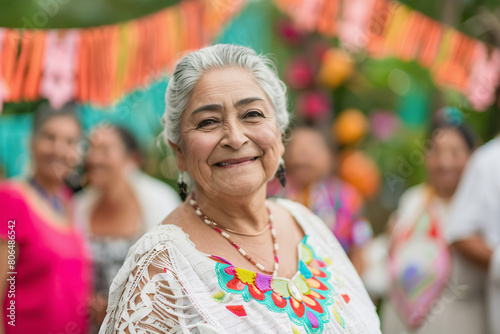 Senior Hispanic Woman Enjoying Outdoor Gathering