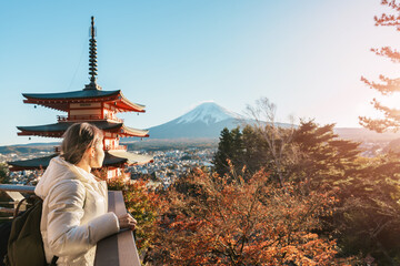 Woman tourist with mount Fuji at Chureito Pagoda in Autumn season, Traveler travel Arakurayama Sengen Park, Yamanashi, Japan. Landmark for tourist attraction. Japan Travel, Destination and Vacation
