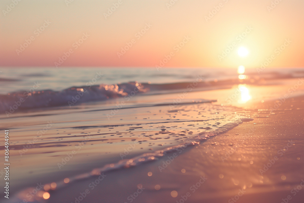 Fototapeta premium Depicting the allure of a sunset on the horizon with a close-up shot of the sun dipping below the sandy beach, painting the sky in a myriad of colors