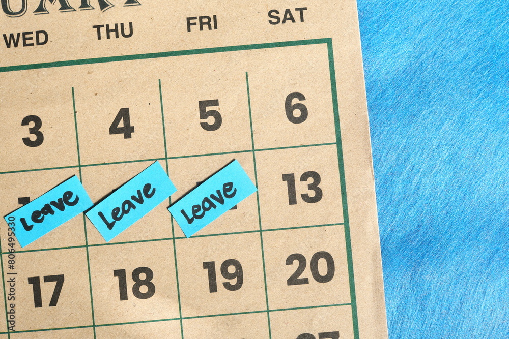 Annual leave from office work concept. Written reminder note on calendar.