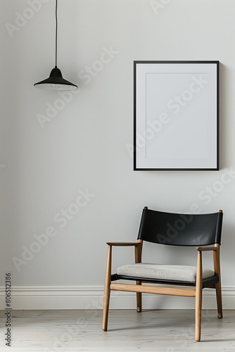 The simulation of a black frame with a white coating contrasts with the plain white wall. and simple furniture,