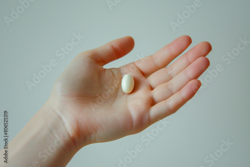 top view of two hands with a bunch of beautiful capsules