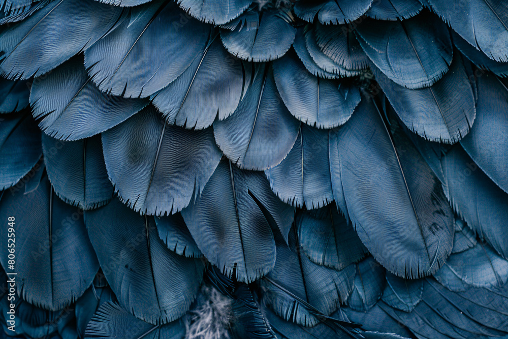 Obraz premium Close-up of a vibrant blue and yellow macaw with intricate feather patterns against a lush green plant background
