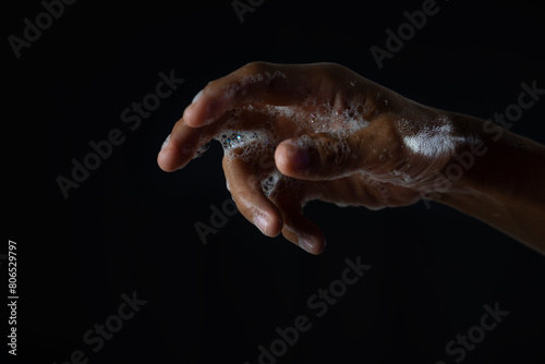 hand of the person wet with soap foam