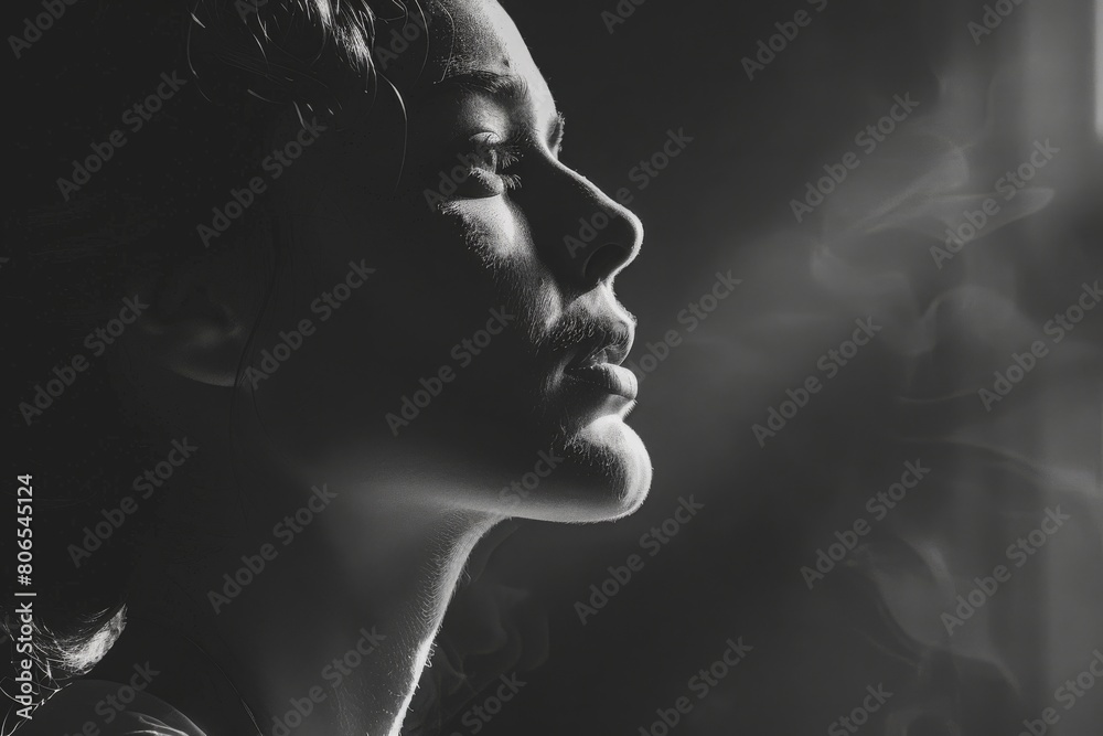 A woman's face is shown in a black and white photo, with a focus on her nose A woman's face is shown in a black and white photo, with a focus on her nose