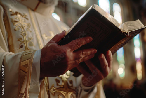 priest who puts his hand on the bible and swears close up