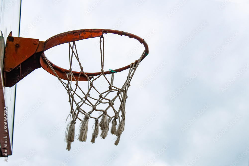 Basketball net with sky background