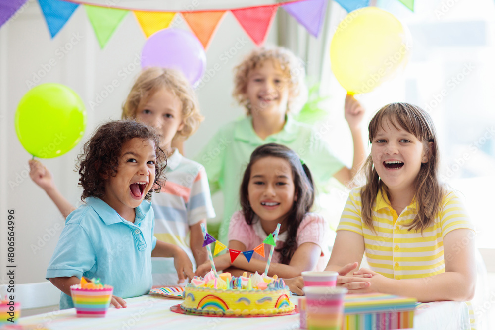 Fototapeta premium Kids birthday party. Children with cake and gifts