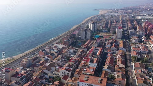 Picturesque drone view of modern Vilassar de Mar cityscape on Mediterranean coast on sunny winter day, Spain photo