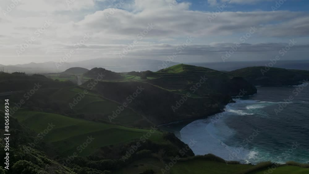 aerial view of picturesque coastal landscape of the Azores, Portugal, featuring a beautiful beach juxtaposed with lush green fields. aerial view of picturesque coastal landscape of the Azores, Portugal, featuring a beautiful beach juxtaposed with lush green fields.