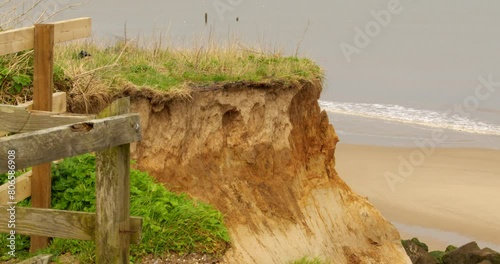 Mid shot of coastal erosion of the cliffs at Happisburgh in March 2024. photo