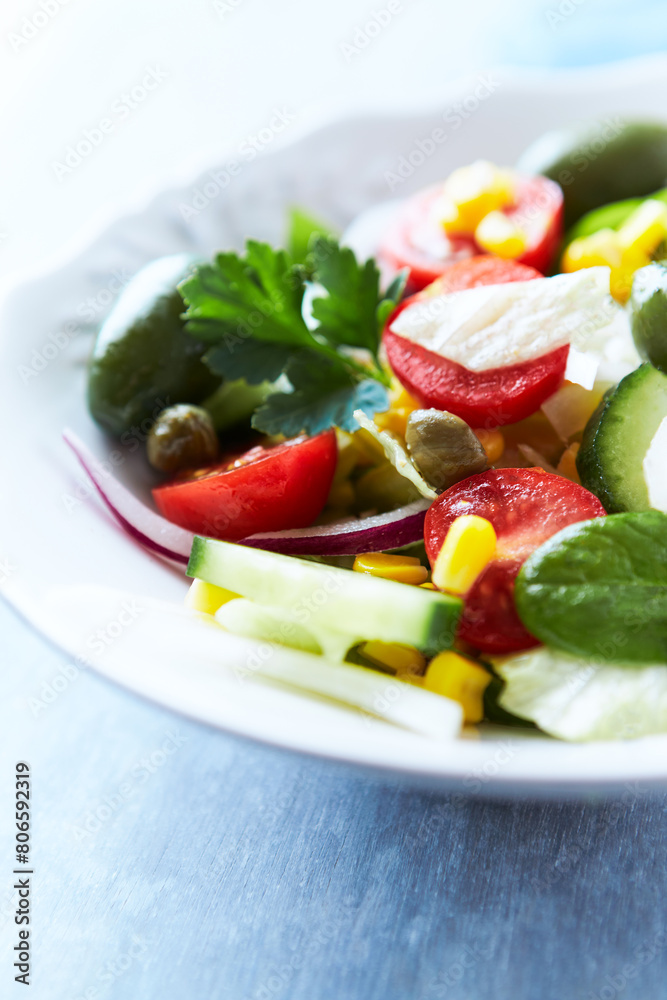 Simple Salad with Green Olives, Cucumber and Cherry Tomatoes. Bright wooden background. Simple Salad with Green Olives, Cucumber and Cherry Tomatoes. Bright wooden background.