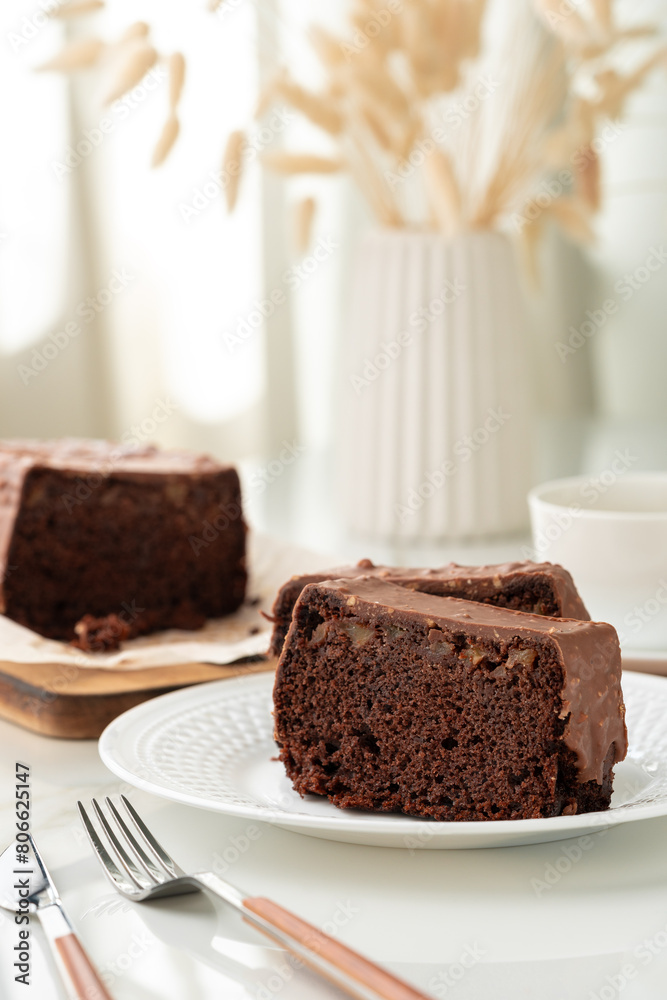 Fresh homemade chocolate sponge cake on wooden board Fresh homemade chocolate sponge cake on wooden board