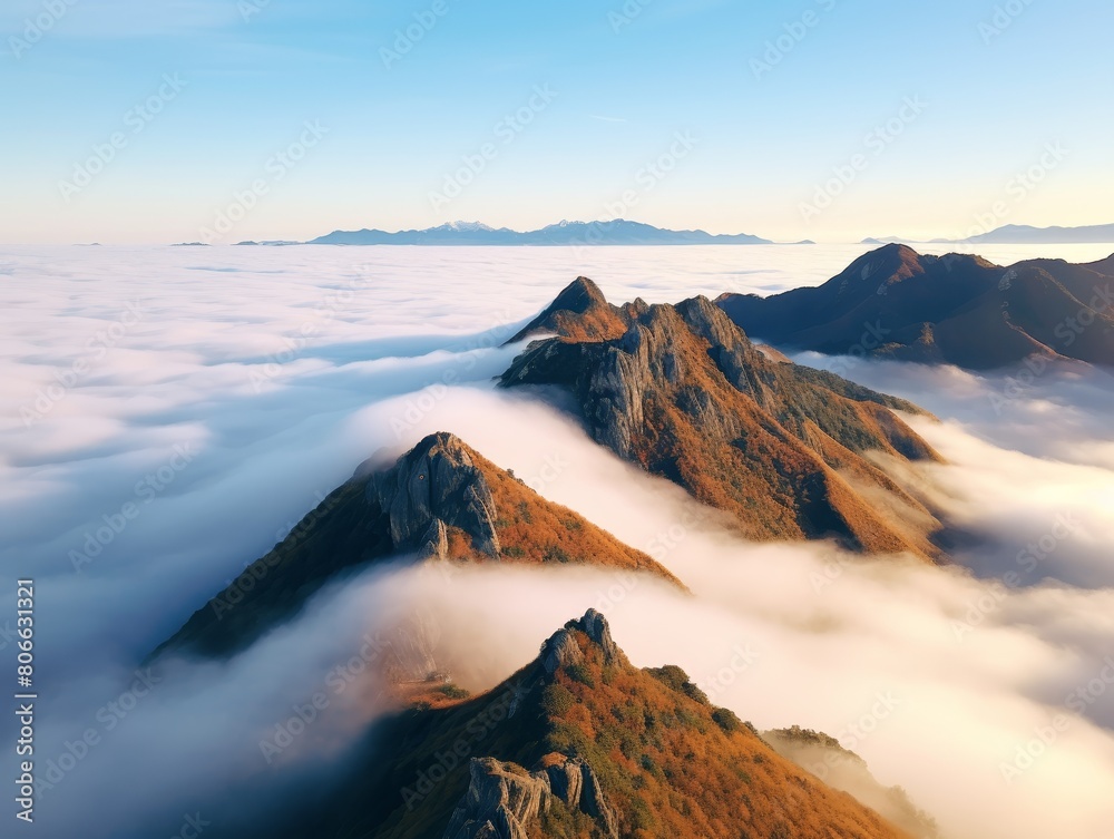 Majestic mountain peaks emerging from the clouds
