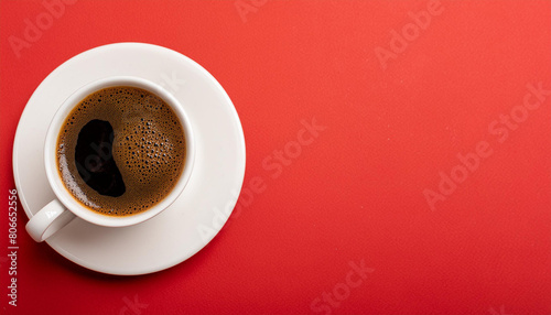 Coffee cup from above on a bold red background  copy space on a side