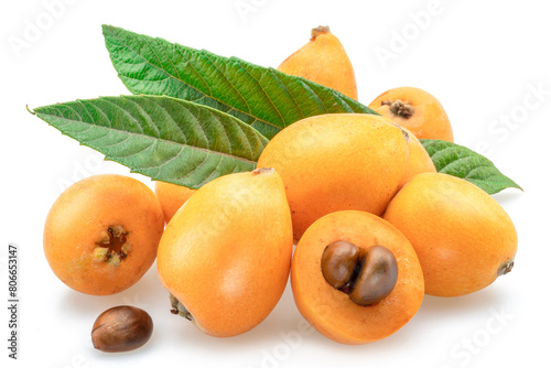 Ripe perfect loquat fruits with green leaves isolated on white background.