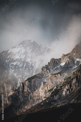 Photography clouds over the mountains covered in snow