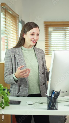 Smiling caucasian businesswoman having virtual call meeting during remote working from home