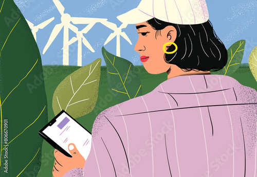 Agronomist with tablet PC at wind turbines in green field