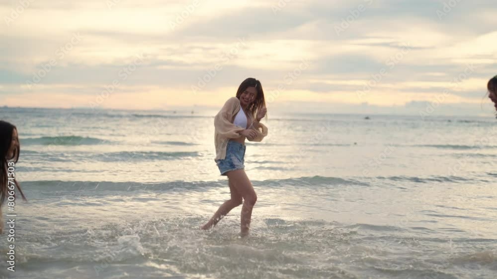4K Group of Young Asian woman enjoy and fun outdoor lifestyle travel nature ocean on summer beach holiday vacation. Attractive girl friends walking and playing together at the sea on tropical island. 4K Group of Young Asian woman enjoy and fun outdoor lifestyle travel nature ocean on summer beach holiday vacation. Attractive girl friends walking and playing together at the sea on tropical island.