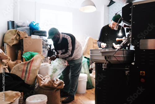 Coffee roasters working together at factory photo