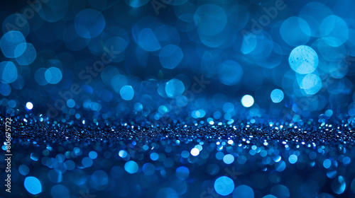 vivid blue glitter with defocused twinkly lights in an abstract background.