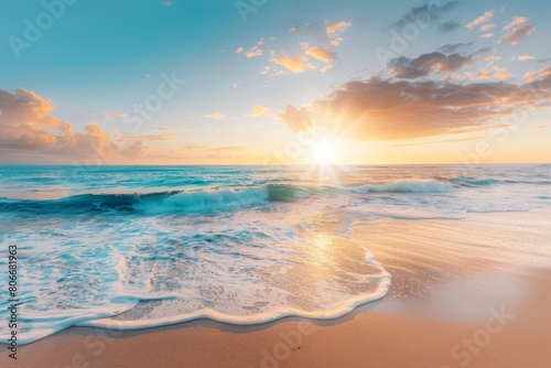 Sunset over calm sea with sandy shore