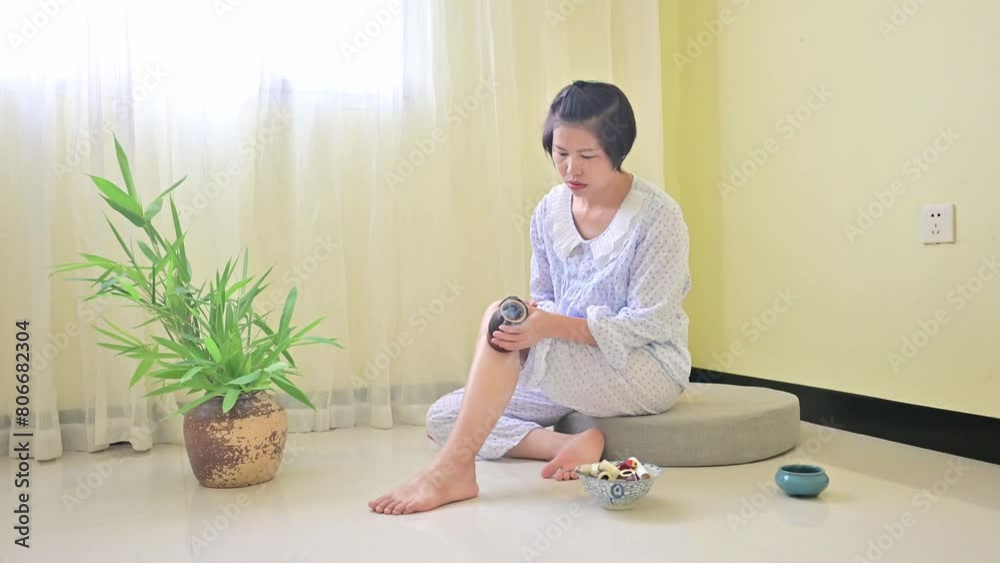 A Chinese woman is doing moxibustion therapy A Chinese woman is doing moxibustion therapy