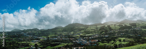 Portugal, Azores, Capelas, Summer clouds over village on San Miguel island photo