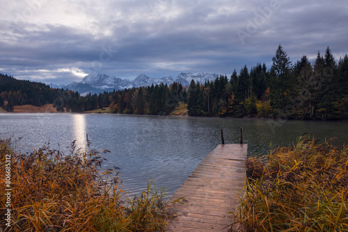 Germany, Bavaria,Jetty at lake Geroldsee on cloudy autumn day photo