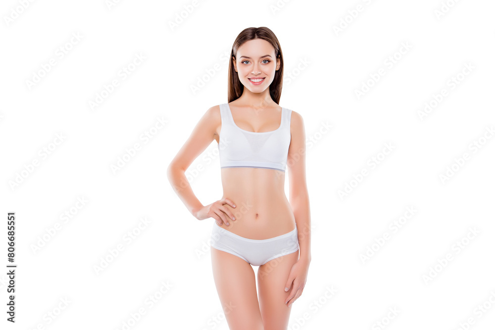 Portrait of sportive fit woman with perfect body in white cotton underwear bikini isolated over white background holding hand on waist. Wellness wellbeing shape concept Portrait of sportive fit woman with perfect body in white cotton underwear bikini isolated over white background holding hand on waist. Wellness wellbeing shape concept
