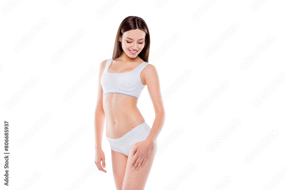 Portrait of thin sportive woman with perfect body in white cotton underwear bikini isolated over white background touching hips enjoying smooth ideal leg's skin Portrait of thin sportive woman with perfect body in white cotton underwear bikini isolated over white background touching hips enjoying smooth ideal leg's skin