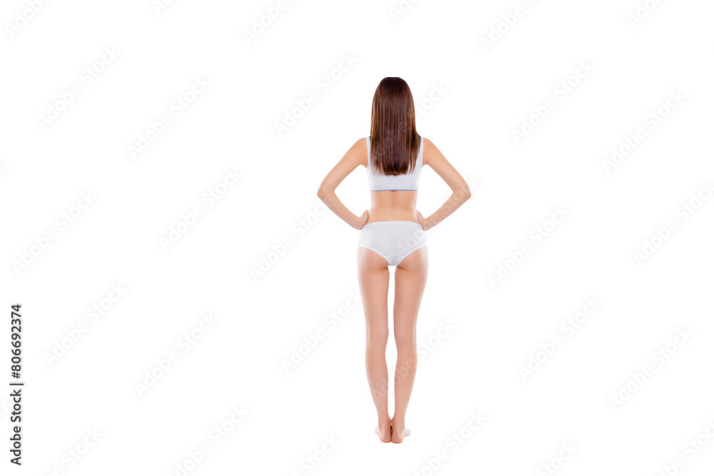 Full length rear view of perfect seductive girl with fit booty bum and slim legs wearing cotton underwear holding two hands on waist demonstrate ideal figure isolated on white background Full length rear view of perfect seductive girl with fit booty bum and slim legs wearing cotton underwear holding two hands on waist demonstrate ideal figure isolated on white background