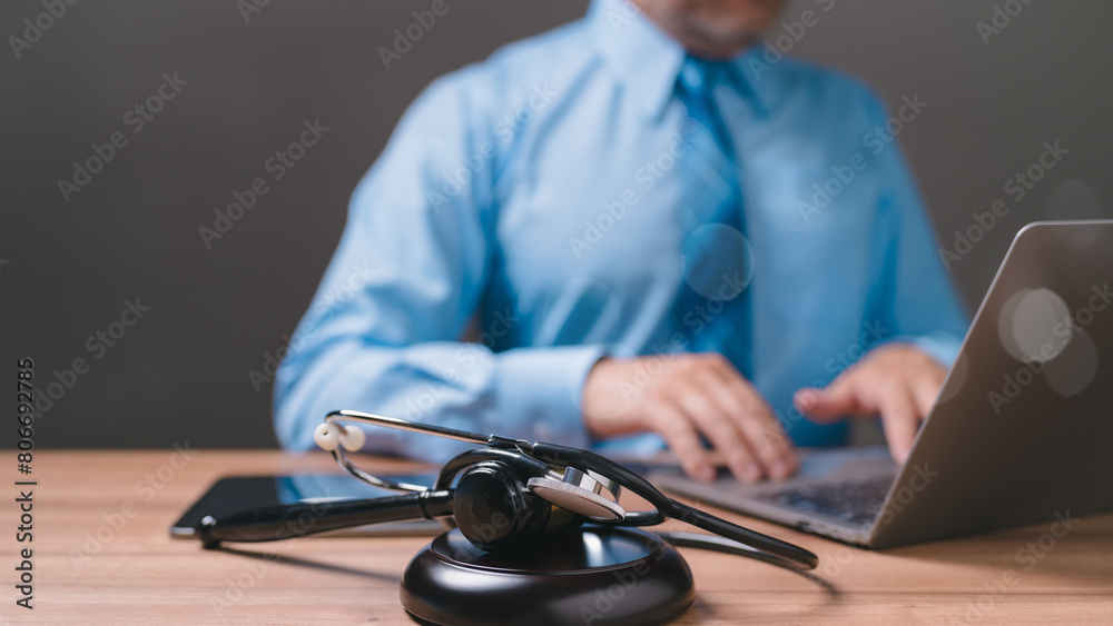 The lawyer meticulously reviews medical records while prosecuting a lawsuit against the hospital, ensuring adherence to law, and seeking justice for the client's medical malpractice claim. The lawyer meticulously reviews medical records while prosecuting a lawsuit against the hospital, ensuring adherence to law, and seeking justice for the client's medical malpractice claim.