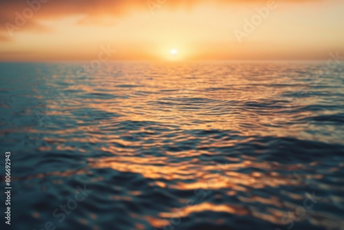Golden sunset reflecting on rippling ocean waves