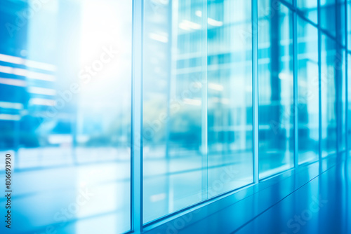 Modern office building featuring expansive blue glass fa  ades that reflect the bright  clear sky  symbolizing corporate transparency and innovation