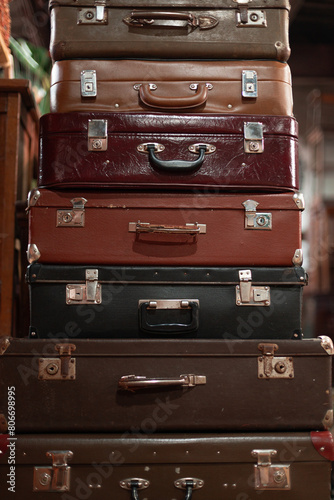 Set of old suitcases. Vintage travel bags.  A Stack of old suitcases in a second-hand store © Leka