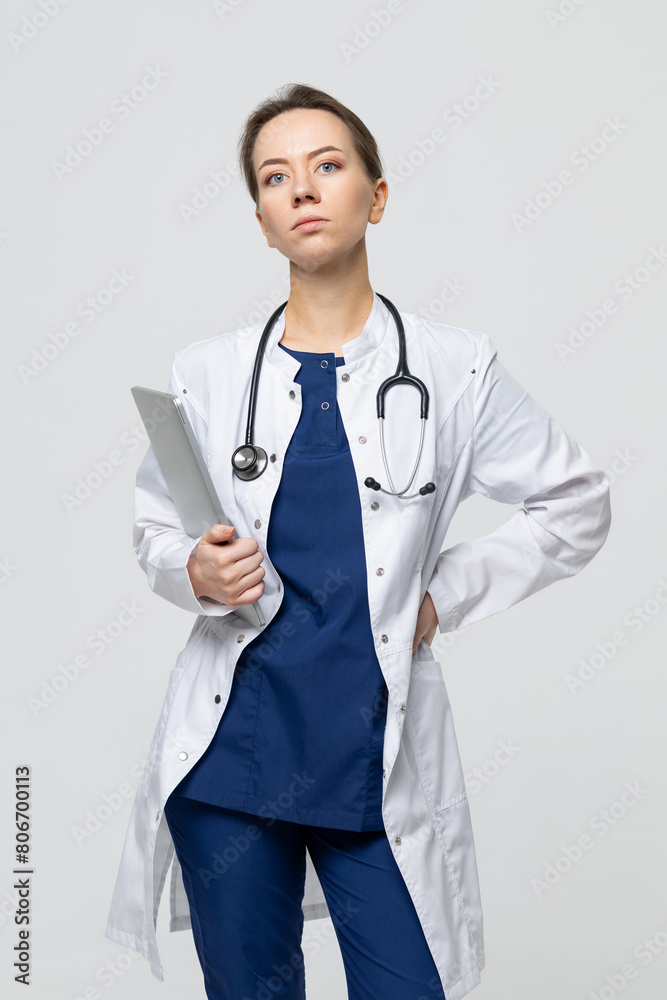Doctor of Medical Sciences with a laptop. A female doctor looks into the camera Doctor of Medical Sciences with a laptop. A female doctor looks into the camera