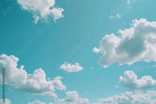 Clouds moving across a clear blue sky 
