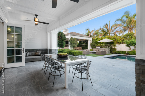Принти на полотні Poolside patio with outdoor dining table in a new construction home in Encino, C