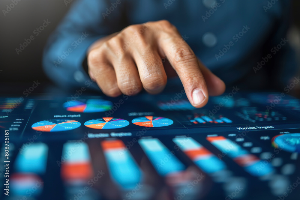 A person in a business suit is interacting with a futuristic touch screen display featuring various colorful graphs and data visualizations for analysis. A person in a business suit is interacting with a futuristic touch screen display featuring various colorful graphs and data visualizations for analysis.
