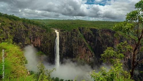 Timelapse, Wallaman Falls in Girringun National Park, Australia, Waterfall and Clouds Above Green Landscape photo