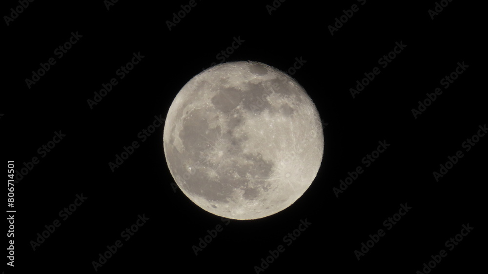 Close-up of a full moon with glowing craters visible Close-up of a full moon with glowing craters visible